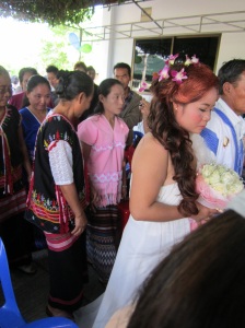 The bride and her father, followed by all of their relatives.